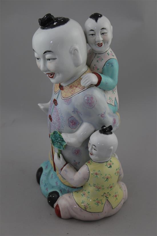 A Chinese enamelled porcelain group of boys, 20th century, 31cm